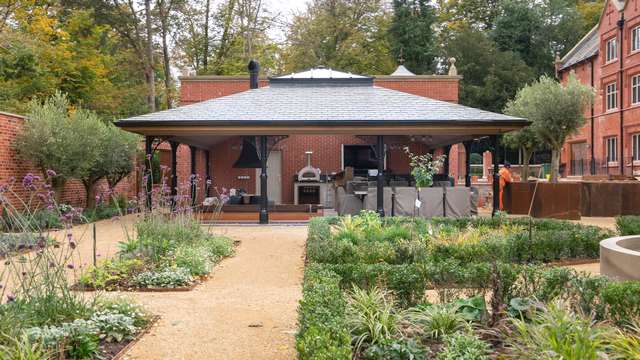 Stunning outdoor planted garden with corten steel edging leading to the outdoor entertaining area.