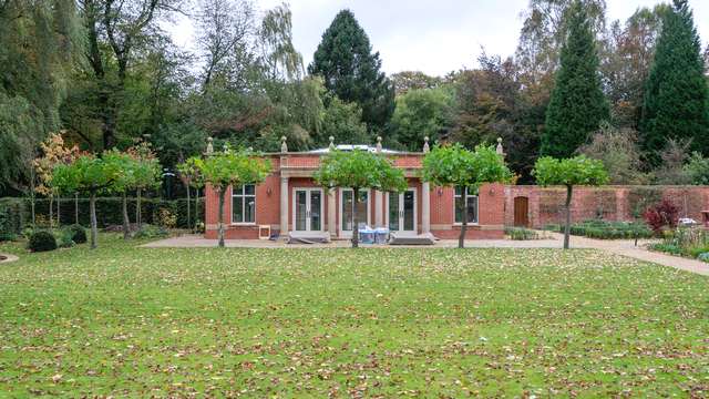 Traditional orangery wih red brick and stone features, fitted with three RAL7016 aluminium roof lanterns with opening roof vents.