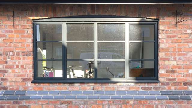 External view of steel alternative aluminium window with dual opening.