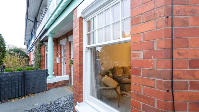 Close up showing the astregal bar detail on the timber alternative sash windows.