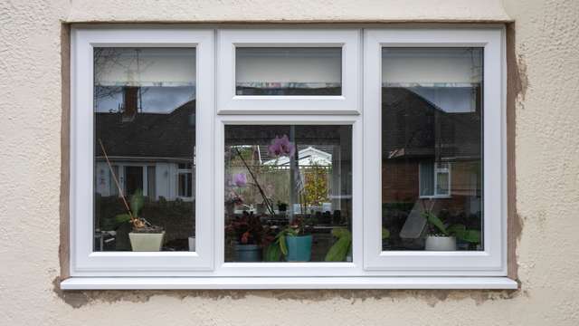 Close up of UPVC sash window replacement with three opening sashes.