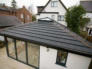 Close up of open plan living space roof featuring aluminium roof lantern in grey for that wow factor internally and externally.