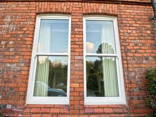 Dual install of perfectly alligned sliding sash windows.