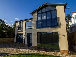 External view of full house installation featuring aluminium windows in Heswall, Wirral.