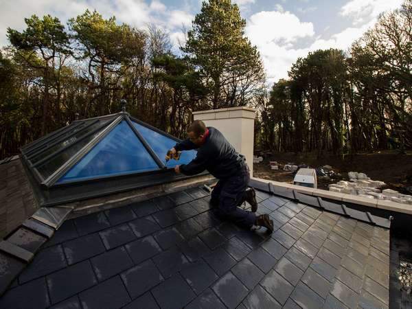 Adding the end caps to this aluminium roof lantern to complete the installation.