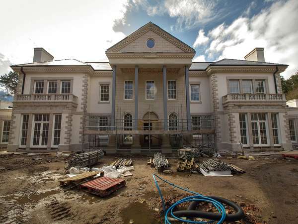 Front view of Firwood project showing the grand entrance. Full glazing installation features lots of sliding sash windows, french doors, roof lanterns and more.