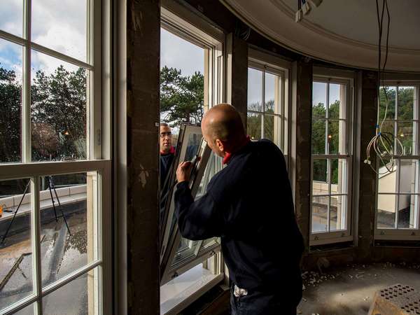 Installation of UPVC tilt and turn sash windows.