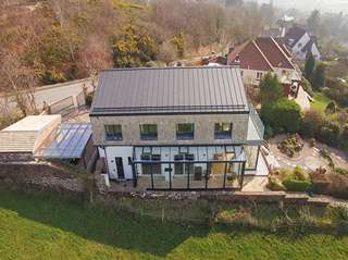 View from above of the buildings roof and aluminium viewing gallery. Internal sliding doors are from Rationel, side door and all 2nd story windows are also from the Internorm range.