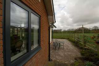 Replacement aluminium windows updating the look of the original house, improving the security and energy efficiency over the original windows.