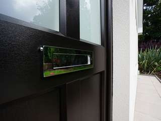 Chrome letterplate contrasting perfectly against the black wood grain finish.
