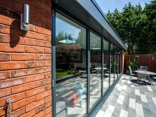 External close up of Aluminium bifold doors allowing lots of Natural light to flood into this property on the Wirral.