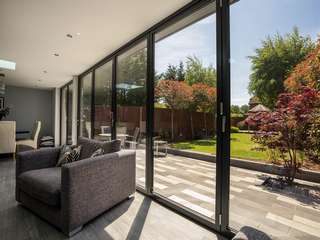 Dual sets of aluminium bifold doors creating the ultimate indoor / outdoor living space perfect for year round dining and entertaining.