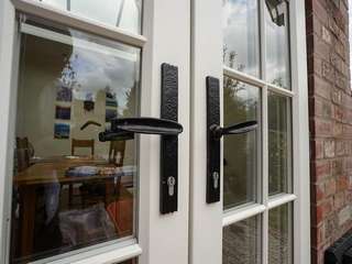 Close up of cast iron door handles.