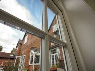 Close up of astregal bars and wood grain affect UPVC profile.