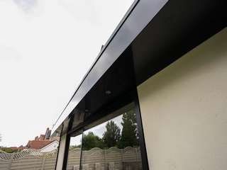 Close up of aluminium roof facia in black to match the aluminium sliding doors.