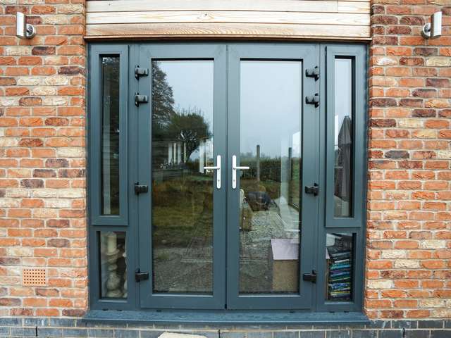 Aluminium french doors in RAL 7016.