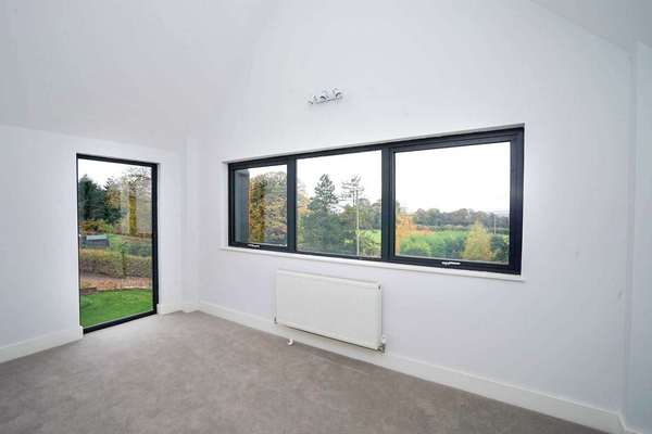 Internal bedroom making the most of the views with large glazed areas.
