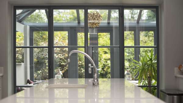 Looking straight on at the Crittall doors from the end of the kitchen.