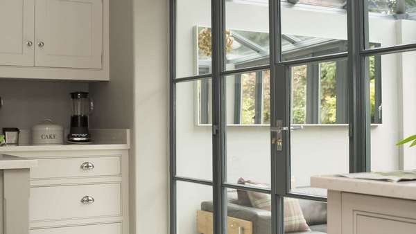 Close up detail of the Crittall screen showing handle and glazing bar details.