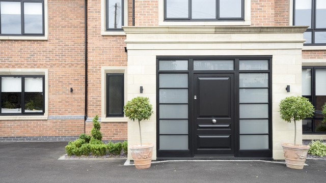 A superb entrance complete with timber door and aluminium windows.