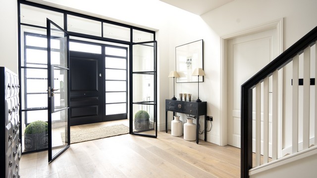 The Crittall entrance with the dual french doors open, adding architectural interest as soon as you enter the home.