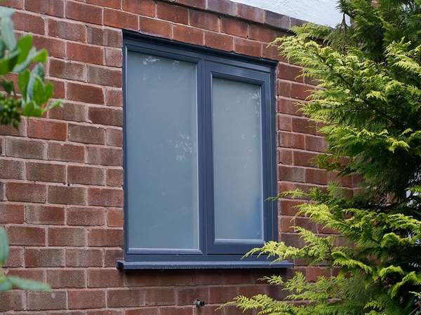 Rationel bathroom window with sand-blasted privacy glass.