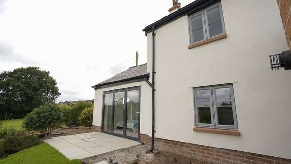 Dual twin opening windows and Centor bifold and landscaped garden.