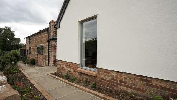 Close up of large single panel Rationel windows with feature cill.