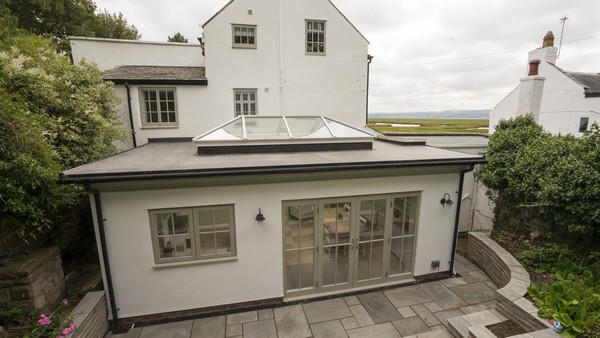 Orangery supplied and fitted with aluminium roof lanterna and timber windows and doors. 