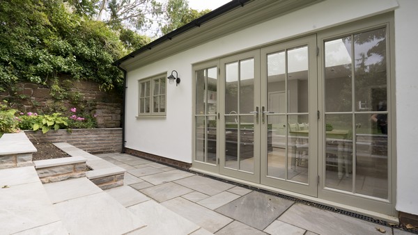 Alternative view of the timber french doors fitted with chrome handles and hinges.