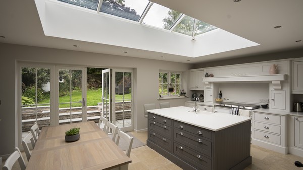 Internal view of this orangery showing kitchen, glazing details and roof lantern.