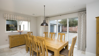 Dining area with small and large 3 panel alu clad window from Rationel.