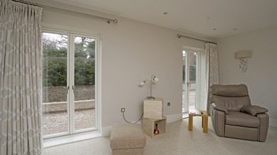 Internal living space with dual alu-clad french doors giving lots of light to this room and easy access to the outside space.