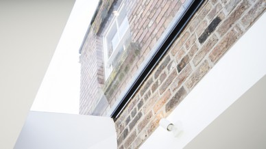 Close up of the brick and glass detail on this project, flooding the space with lots of natural light.