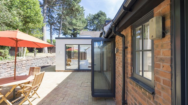 Another view of the external view of this full house glazing installation. Grey windows and doors to the rear of the property with glazing bars for adding aesthetic detail.