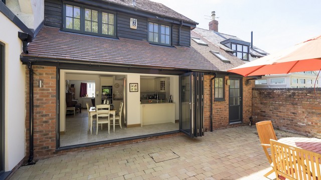 Large bifolding doors at the rear of the property breaking down to barrier between the internal and extenal space. Triple glazing glass panels keep the house warmer in winter and cooler in summer.